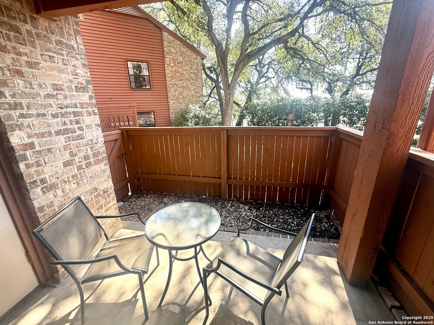 13018 Heimer, Unit 703 San Antonio, TX 78216 - Photo 25 of 28 a backyard of a house with table and chairs