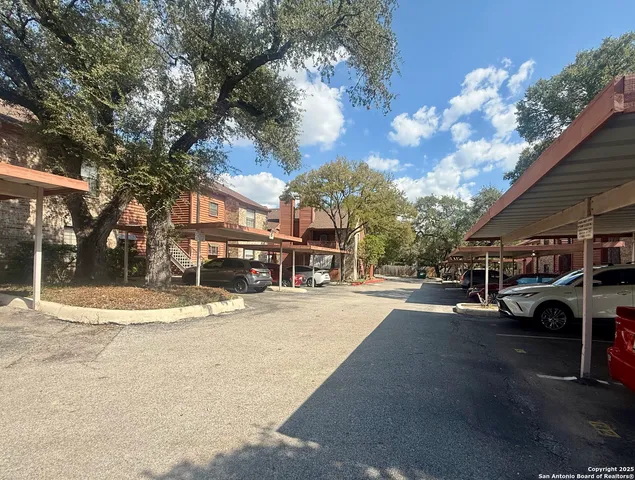 a view of street along with trees