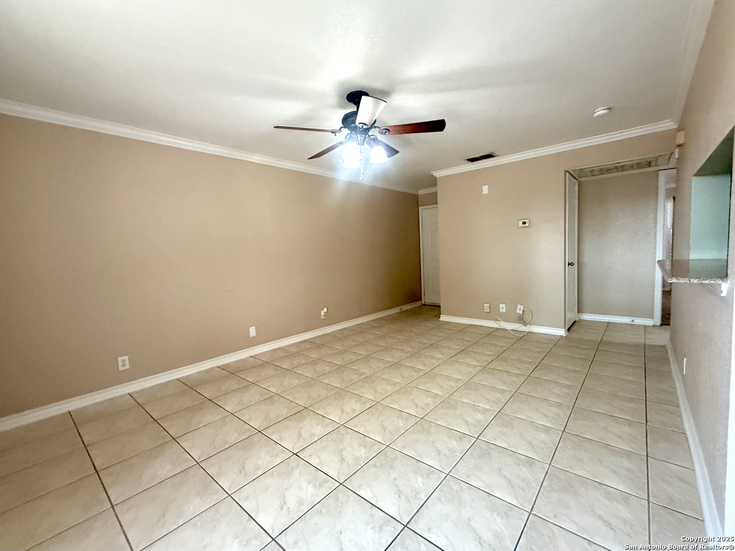 13018 Heimer, Unit 703 San Antonio, TX 78216 - Photo 4 of 28 a view of a livingroom with a ceiling fan and carpet