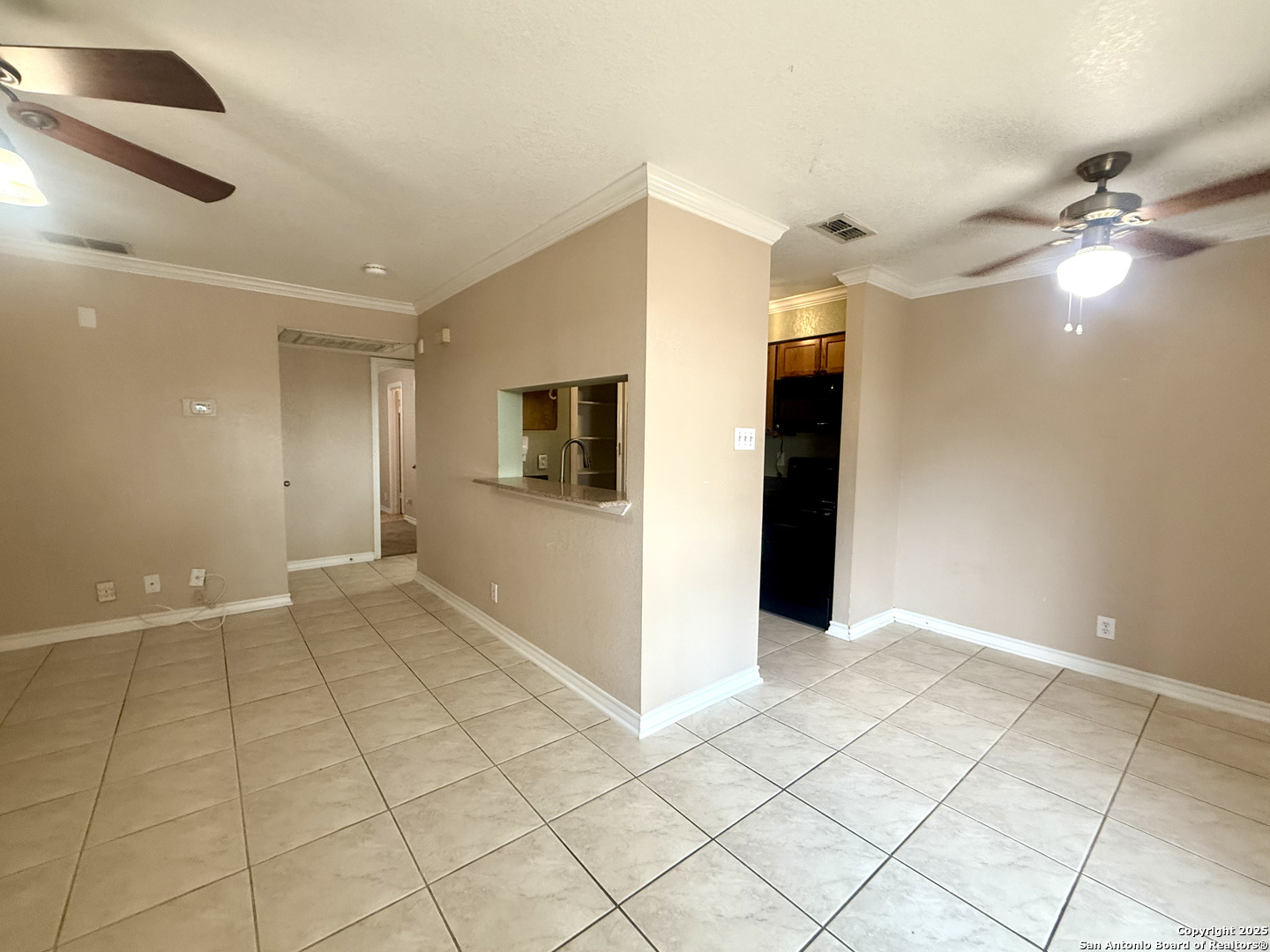 13018 Heimer, Unit 703 San Antonio, TX 78216 - Photo 5 of 28 a view of an empty room with closet and a chandelier fan