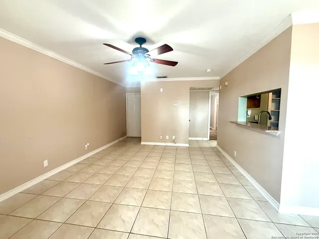 a view of an empty room and window