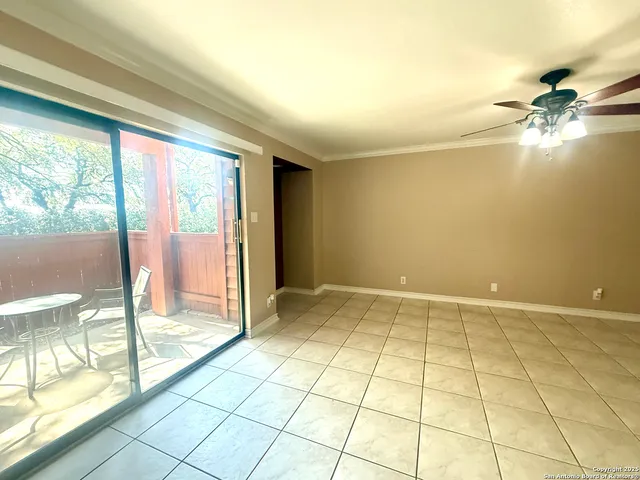 a view of an empty room and window