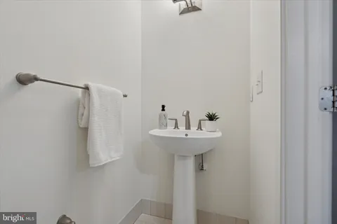 a bathroom with a sink and mirror