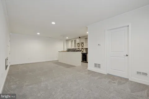 a view of a kitchen with a sink and a refrigerator