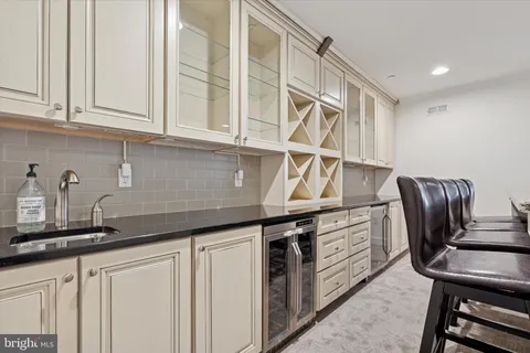 a kitchen with stainless steel appliances granite countertop a sink and cabinets