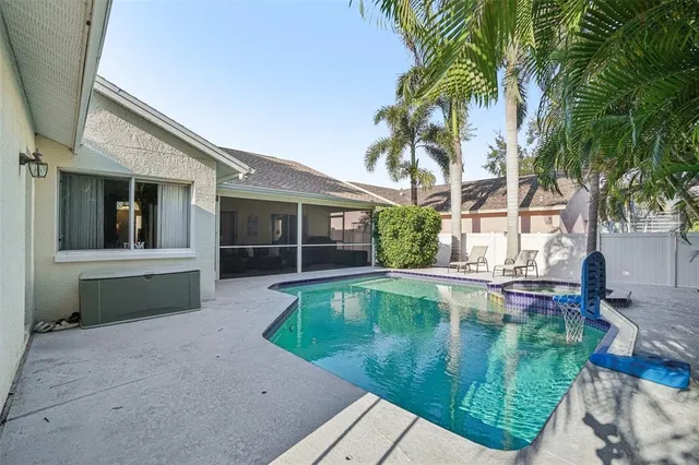 a view of house with backyard outdoor seating and barbeque oven