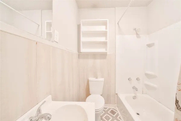 a bathroom with a bathtub and sink