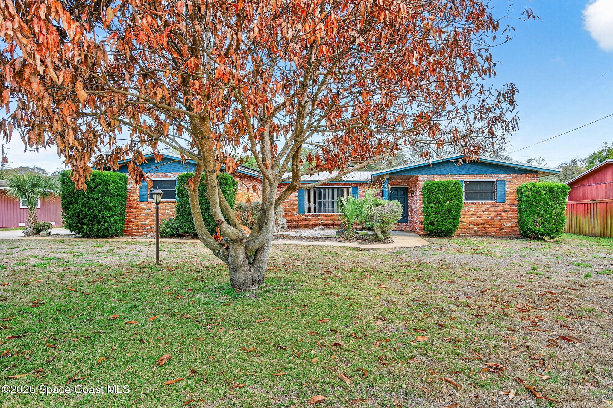a house with trees in the background