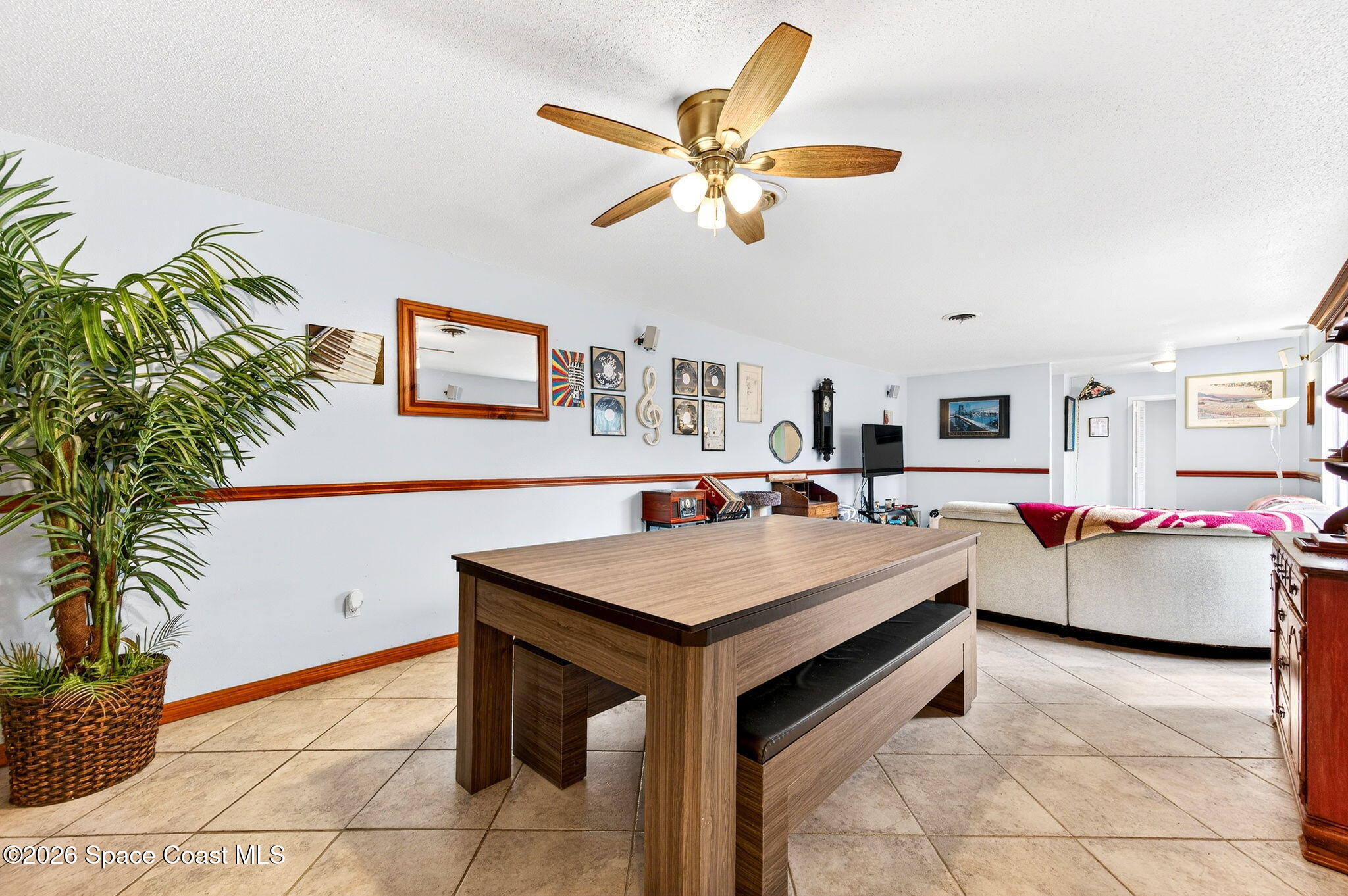 1857 North Carpenter Road Titusville, FL 32796 - Photo 11 of 51 a room with furniture and white walls