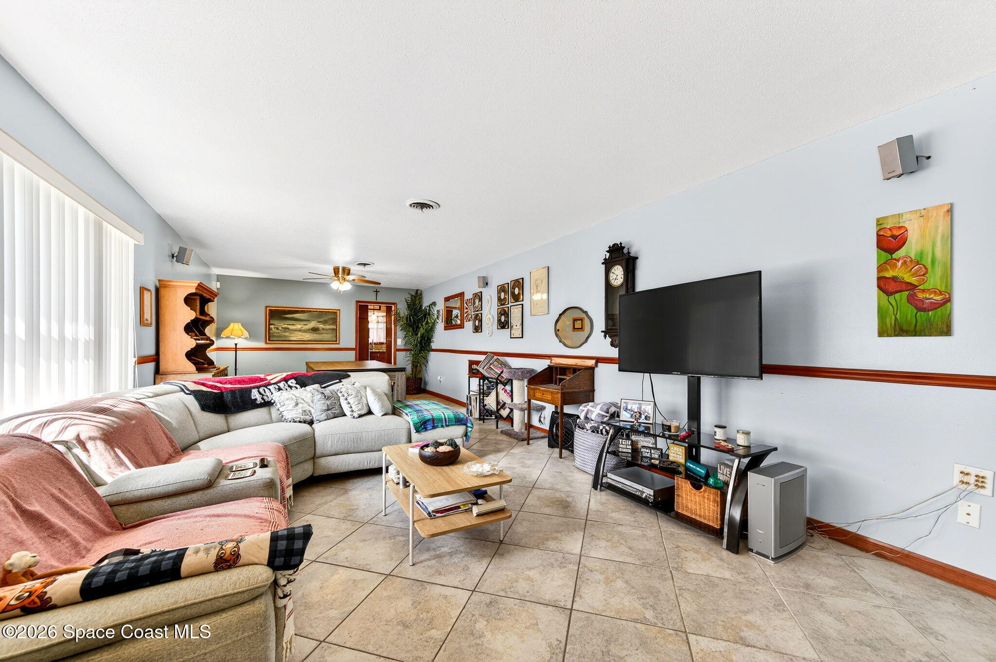 1857 North Carpenter Road Titusville, FL 32796 - Photo 12 of 51 a living room with furniture and a flat screen tv