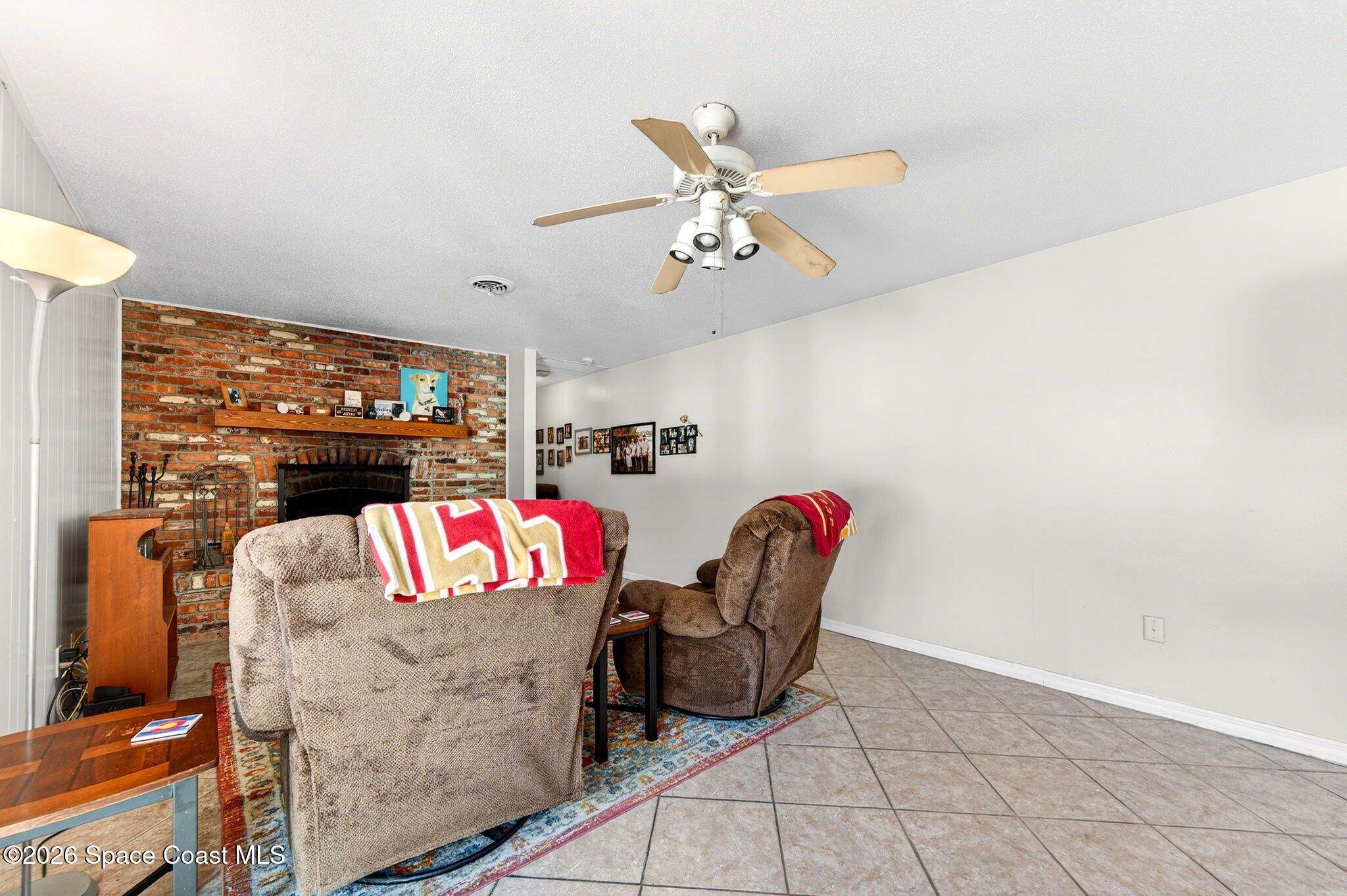 1857 North Carpenter Road Titusville, FL 32796 - Photo 14 of 51 a bedroom with furniture and a flat screen tv