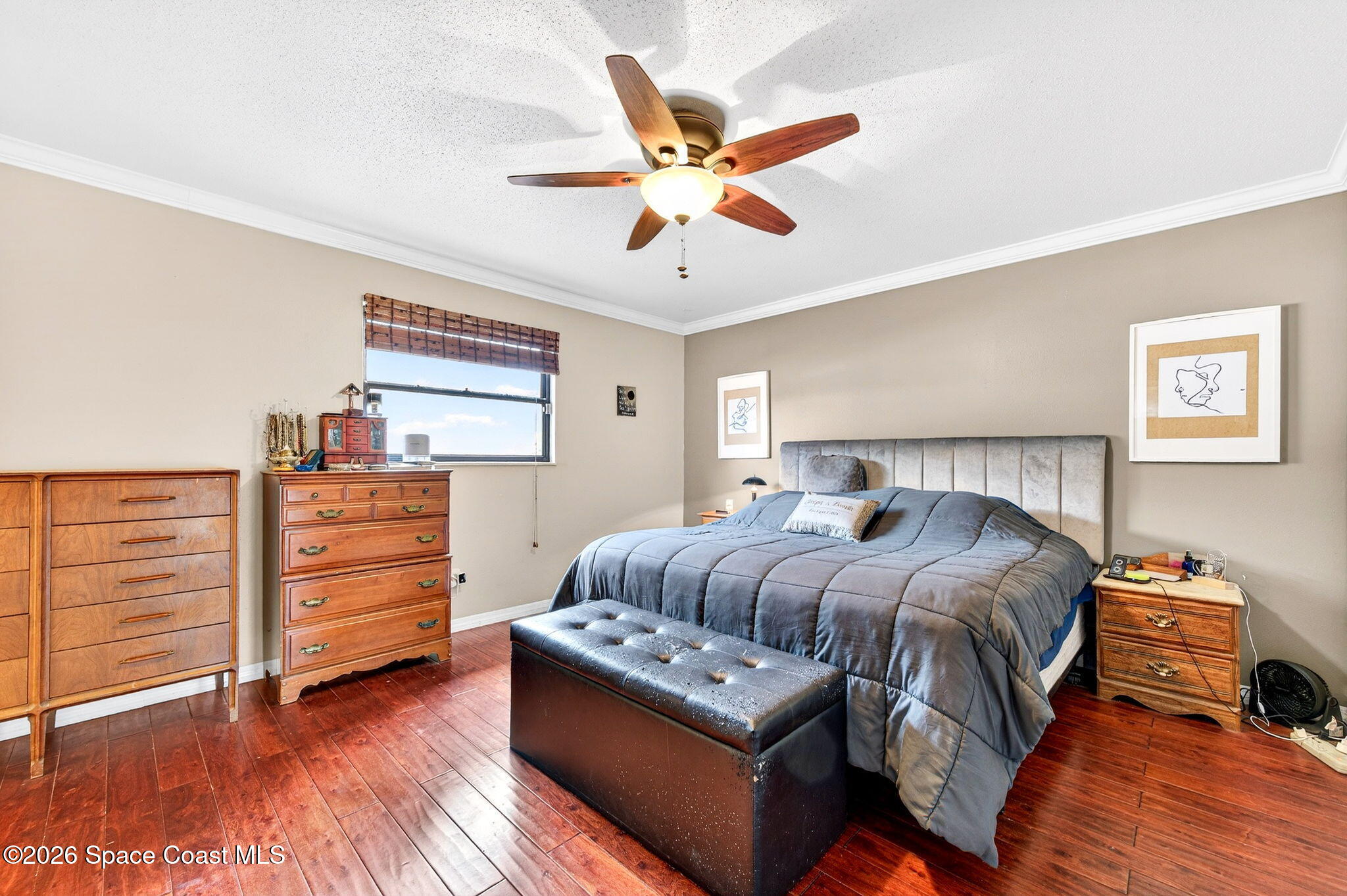1857 North Carpenter Road Titusville, FL 32796 - Photo 17 of 51 a bedroom with a bed and wooden floor
