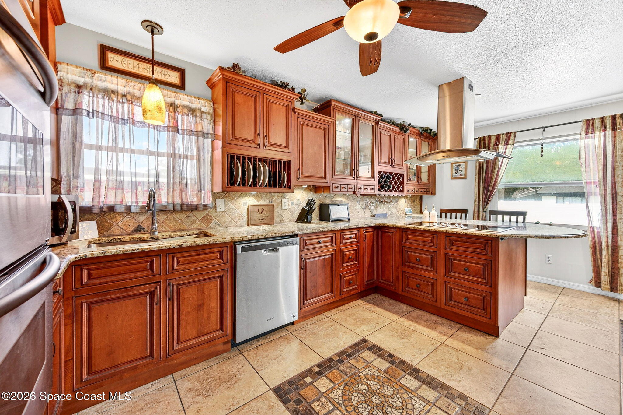 1857 North Carpenter Road Titusville, FL 32796 - Photo 2 of 51 a kitchen with stainless steel appliances granite countertop a stove sink and cabinets