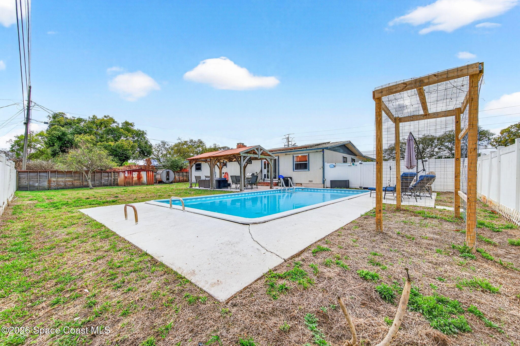 1857 North Carpenter Road Titusville, FL 32796 - Photo 22 of 51 a view of a house with a swimming pool