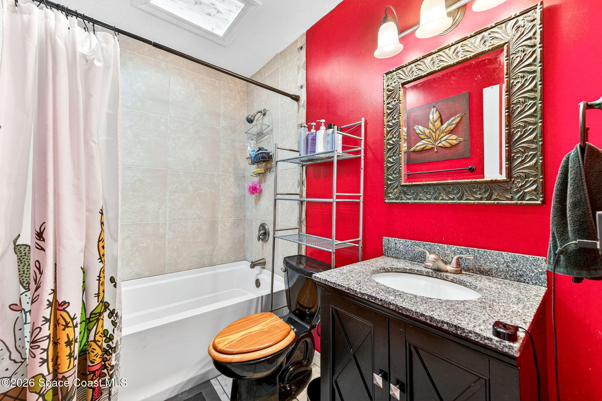 1857 North Carpenter Road Titusville, FL 32796 - Photo 26 of 51 a bathroom with a granite countertop sink and a mirror