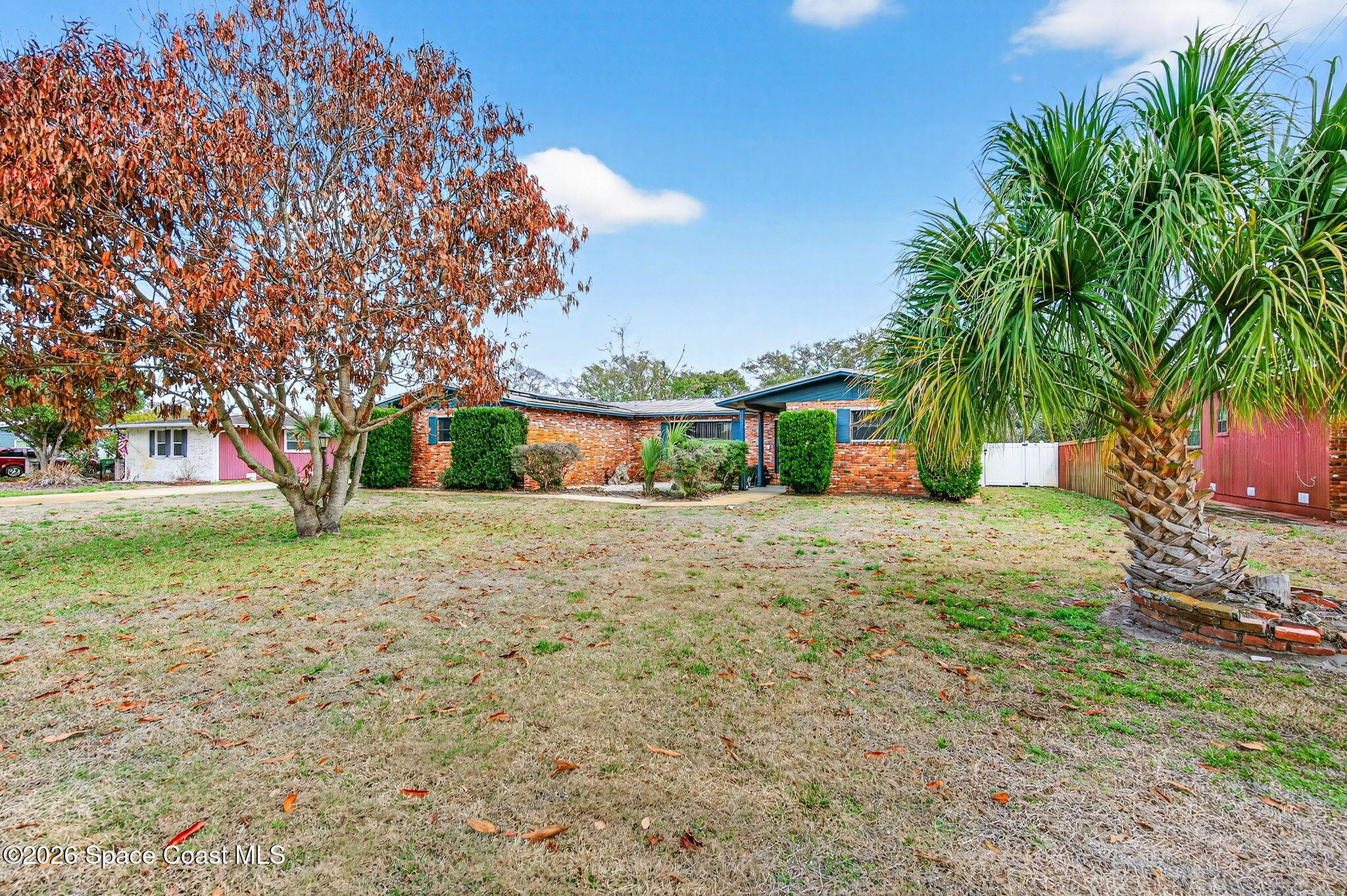 1857 North Carpenter Road Titusville, FL 32796 - Photo 27 of 51 a front view of a house with a yard and garage