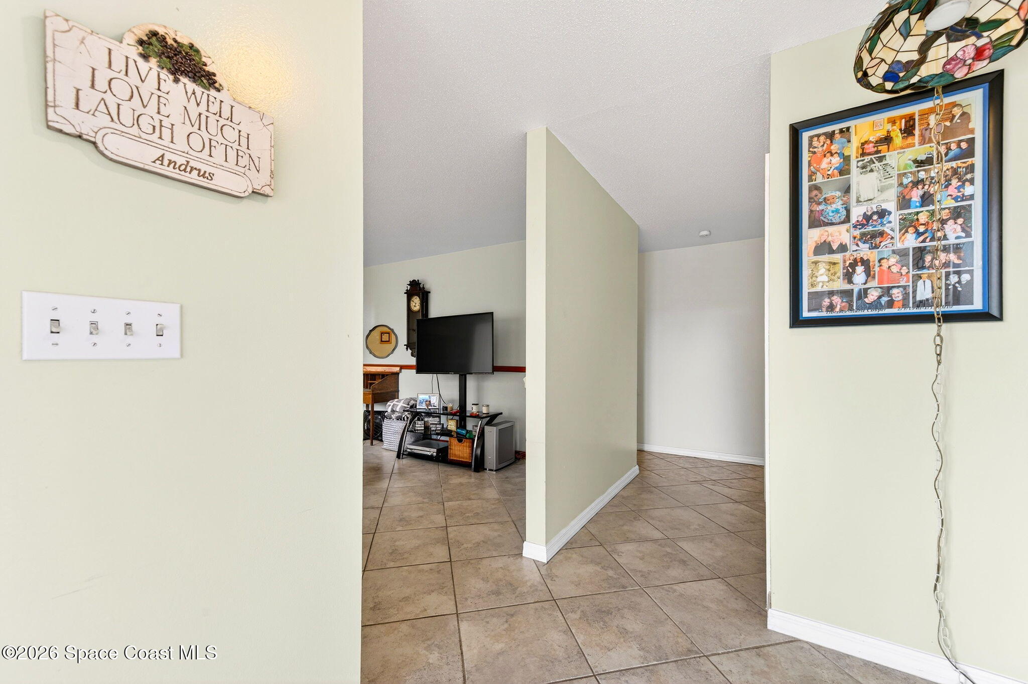 1857 North Carpenter Road Titusville, FL 32796 - Photo 33 of 51 a view of a living room and a baby crib