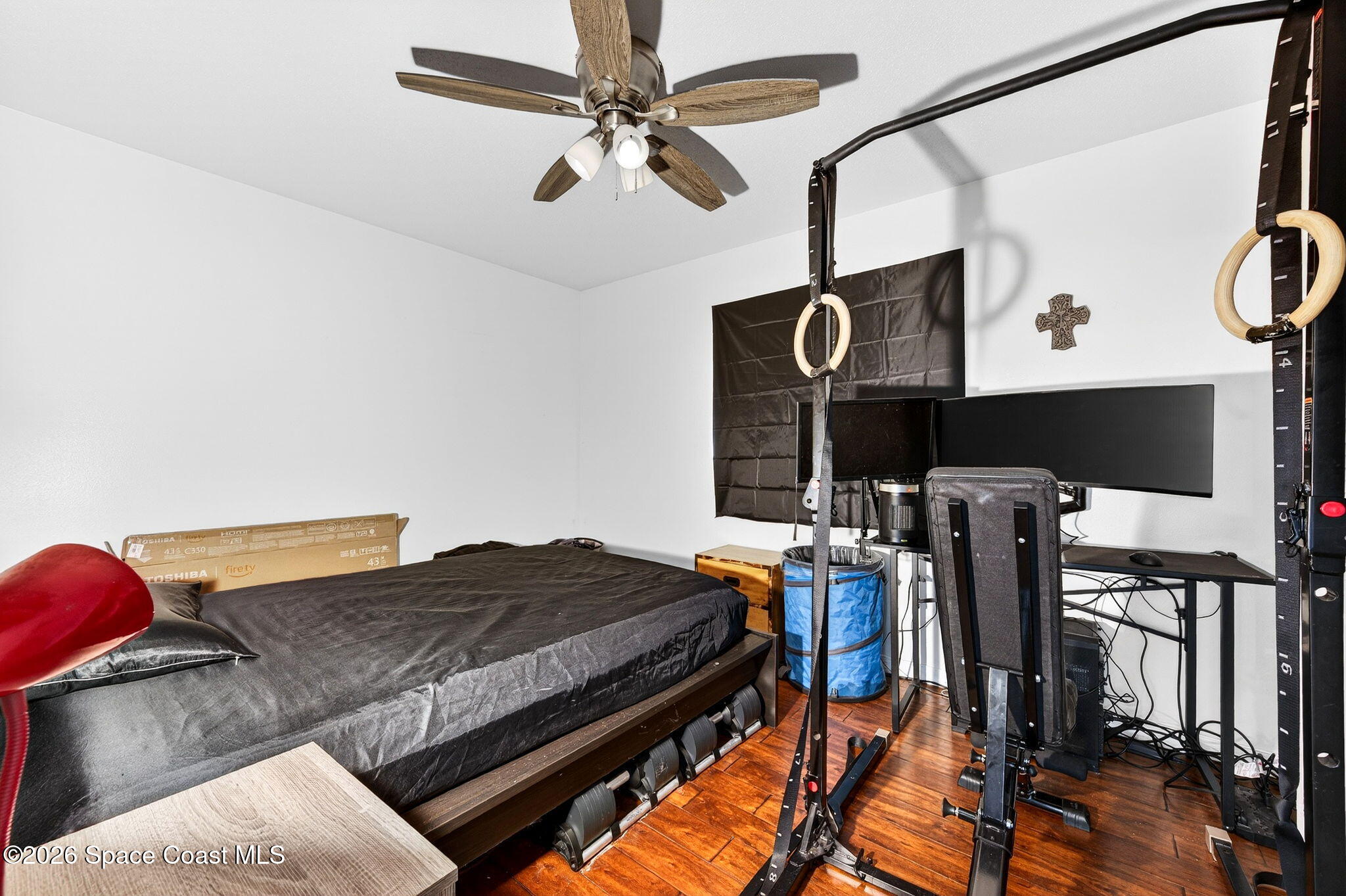 1857 North Carpenter Road Titusville, FL 32796 - Photo 36 of 51 a bedroom with a bed and dresser