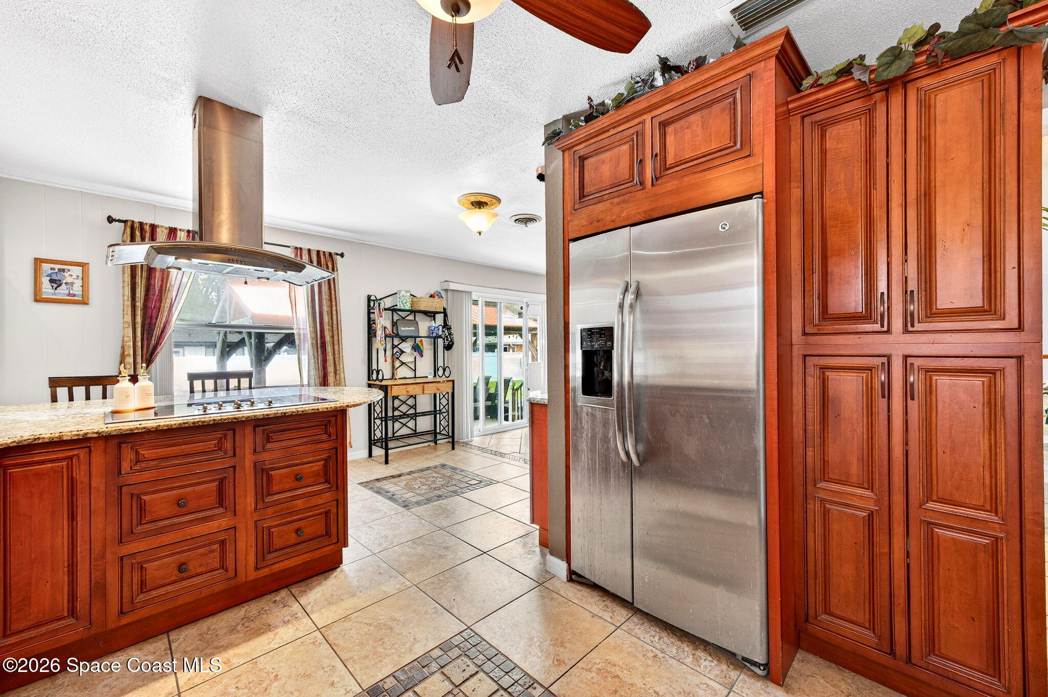 1857 North Carpenter Road Titusville, FL 32796 - Photo 4 of 51 a kitchen with stainless steel appliances granite countertop a refrigerator and a sink