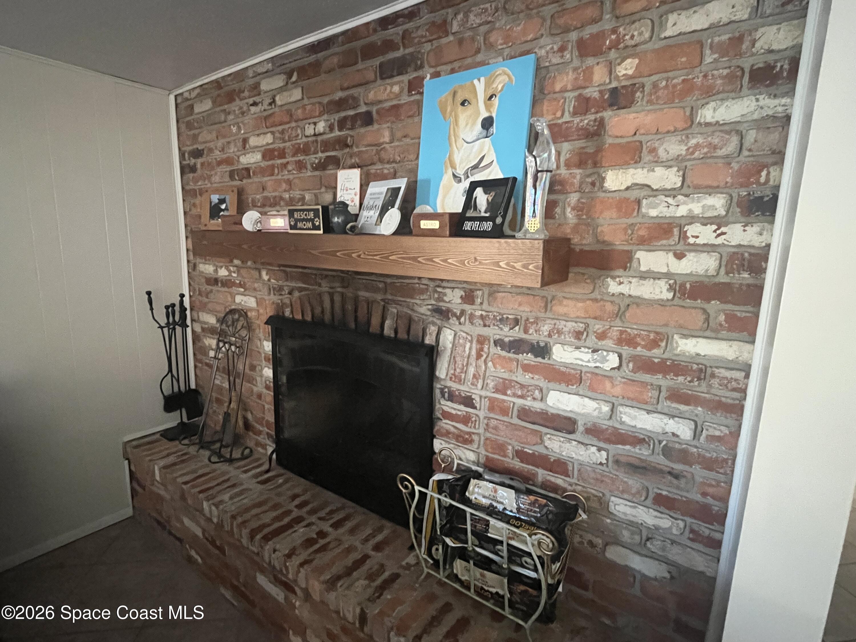 1857 North Carpenter Road Titusville, FL 32796 - Photo 44 of 51 a living room with furniture and a fireplace
