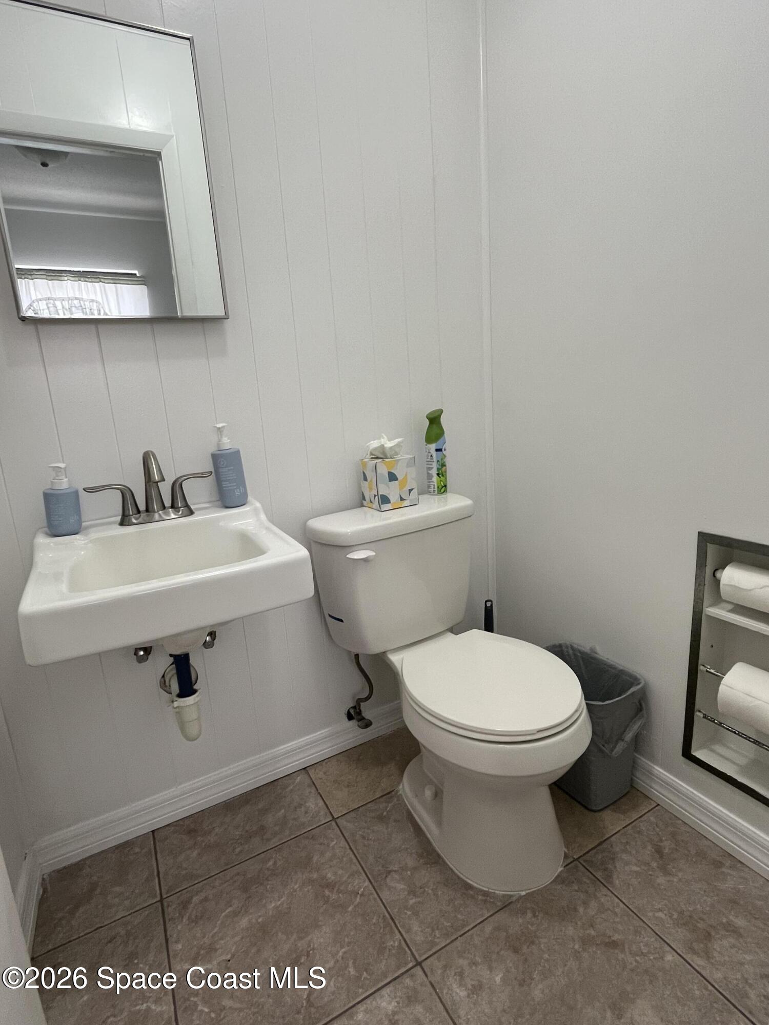 1857 North Carpenter Road Titusville, FL 32796 - Photo 48 of 51 a bathroom with a sink and a toilet