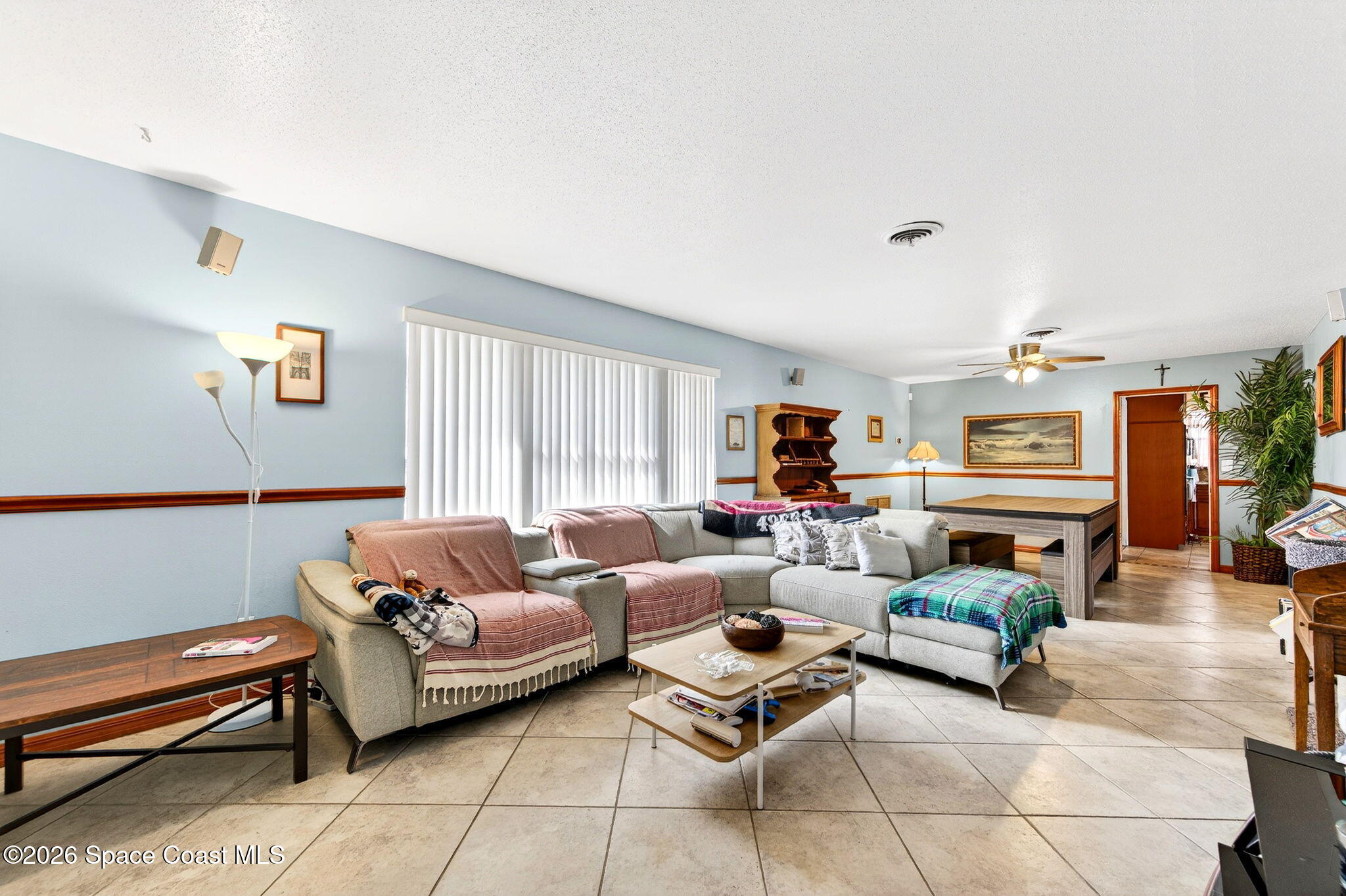 1857 North Carpenter Road Titusville, FL 32796 - Photo 5 of 51 a living room with furniture fireplace and a table