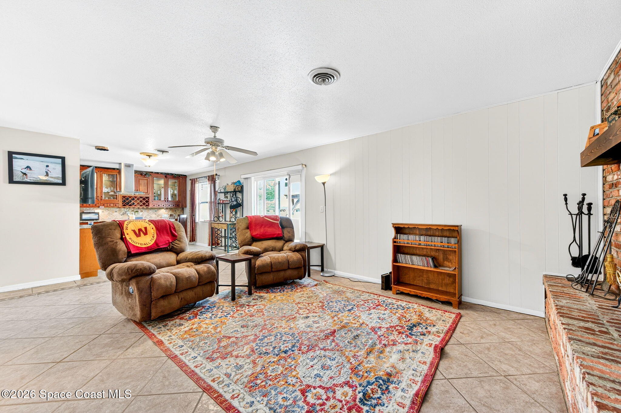 1857 North Carpenter Road Titusville, FL 32796 - Photo 8 of 51 a living room with furniture and a flat screen tv