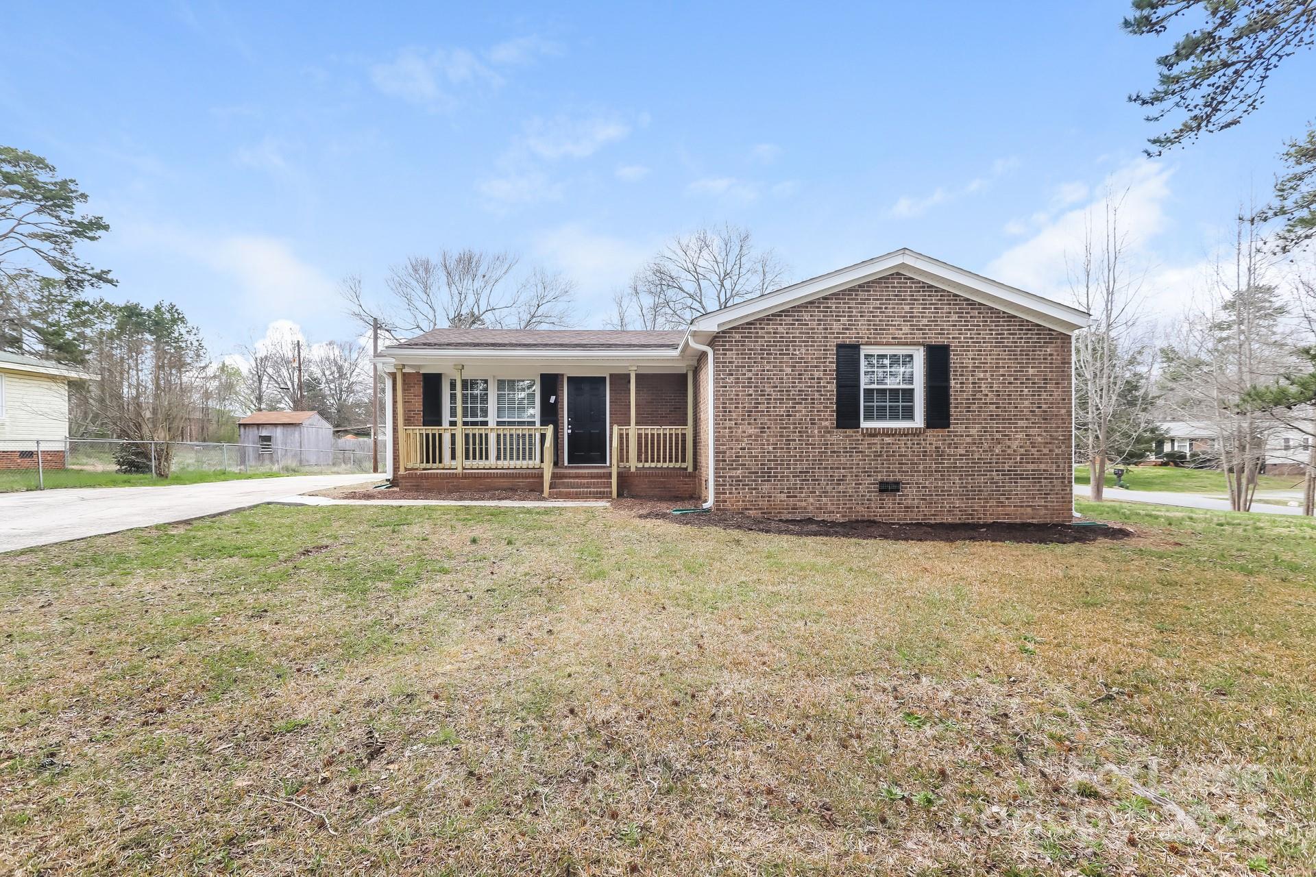 319 Cedarwood Lane Matthews, NC 28104 - Photo 1 of 16 a view of a house with a backyard