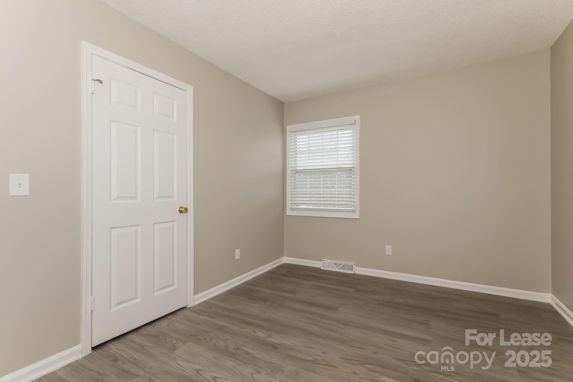 319 Cedarwood Lane Matthews, NC 28104 - Photo 11 of 16 wooden floor in an empty room