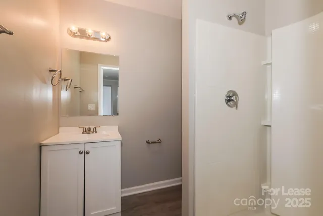 a bathroom with a sink and mirror