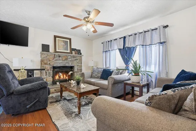a living room with furniture and a lamp