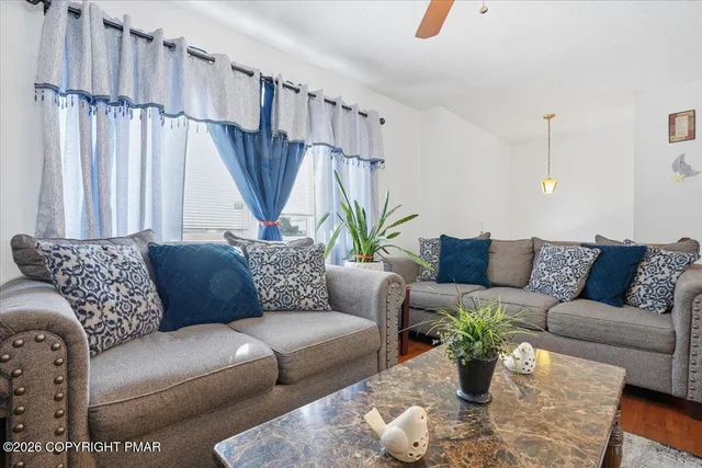 a view of a two chair and table in the outdoor space