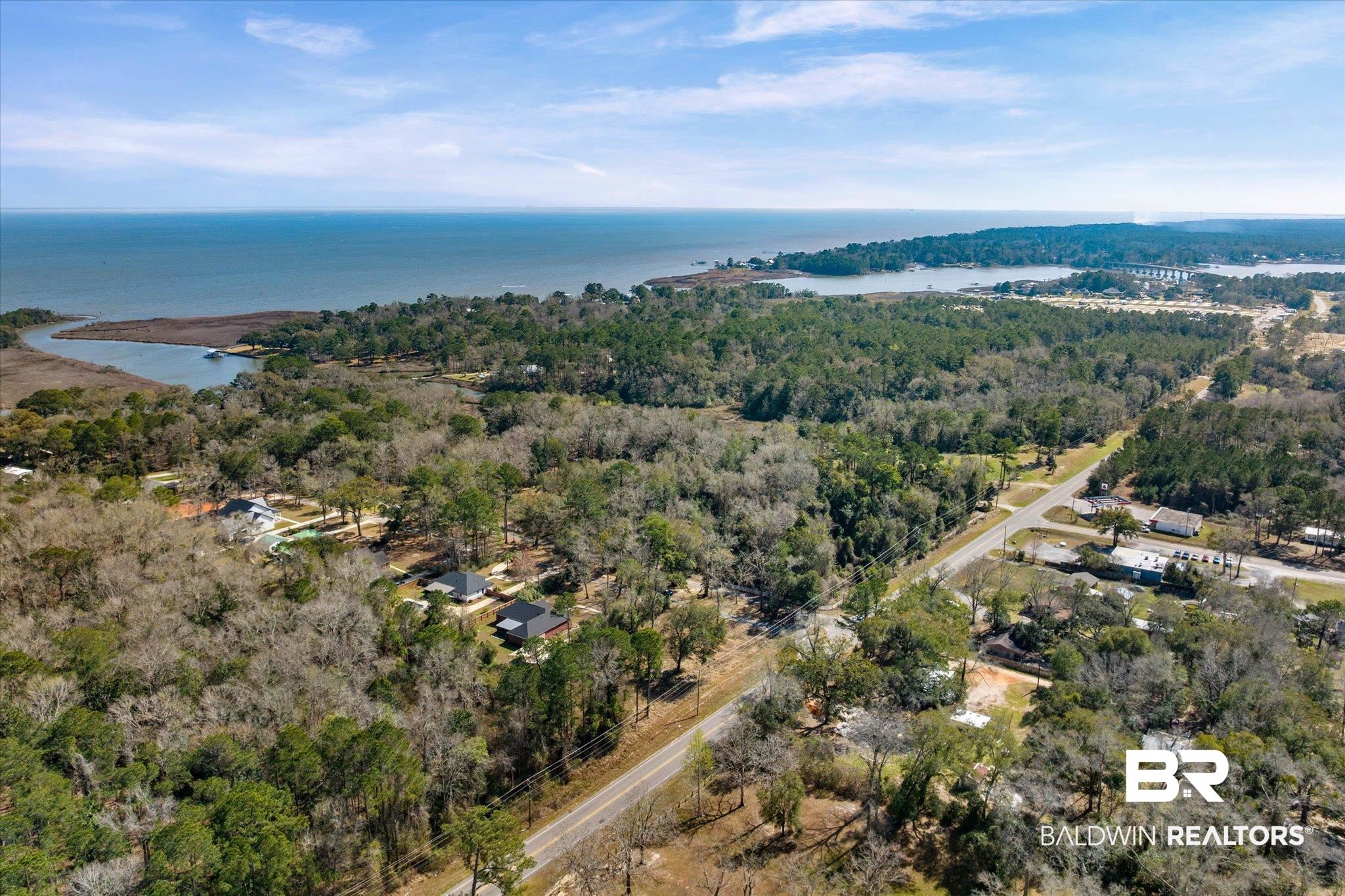 3216 Bay Booster Club Road Theodore, AL 36582 - Photo 37 of 46 Drone / aerial view of a large body of water and a forest