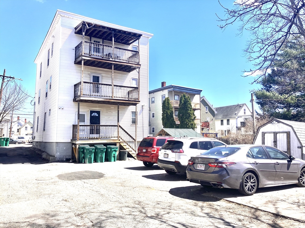 4 Sisson Terrace, Unit 1 Lynn, MA 01902 - Photo 3 of 16 a front view of a house with parking