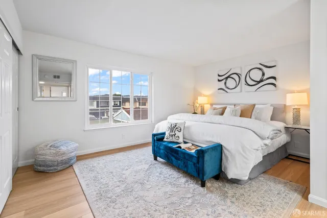 a bedroom with a bed and window