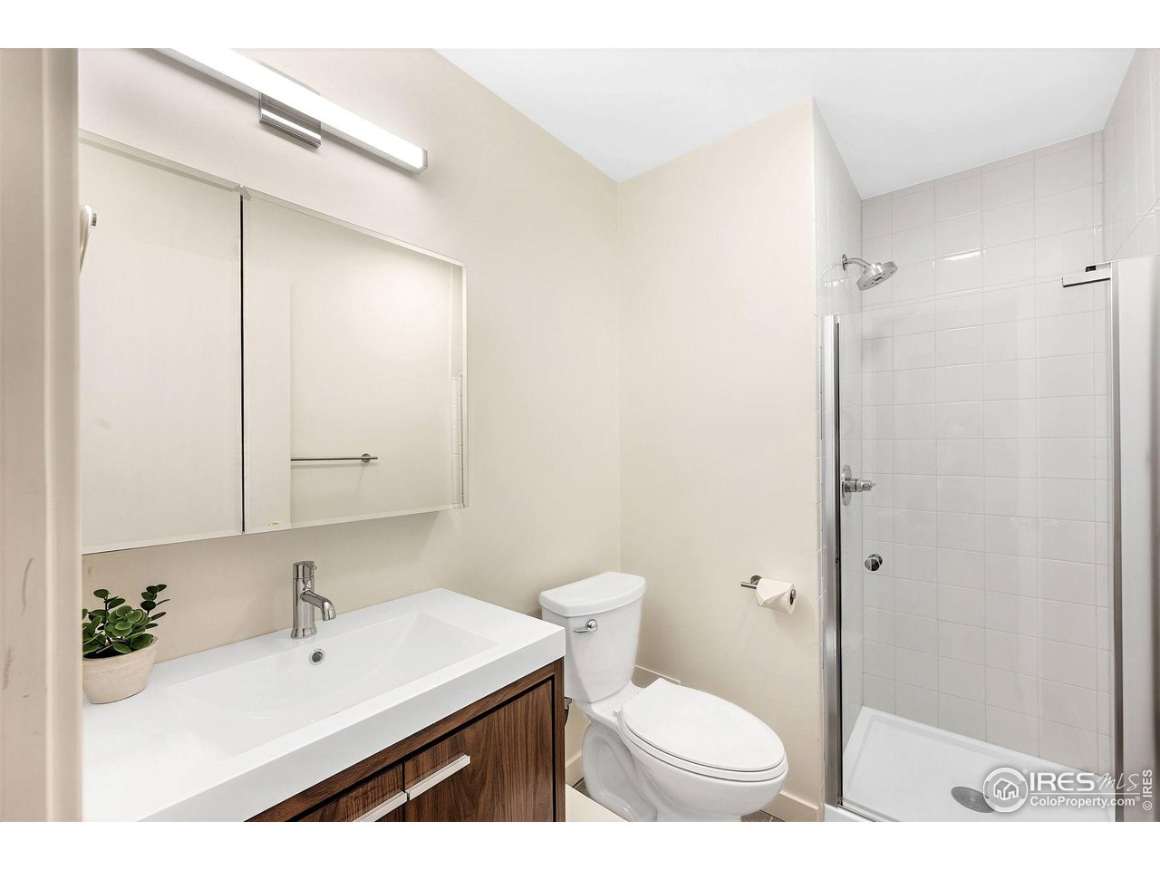 2800 Kalmia Avenue, Unit A-220 Boulder, CO 80301 - Photo 20 of 38 Ensuite primary 3/4 bath with newer vanity and fixtures