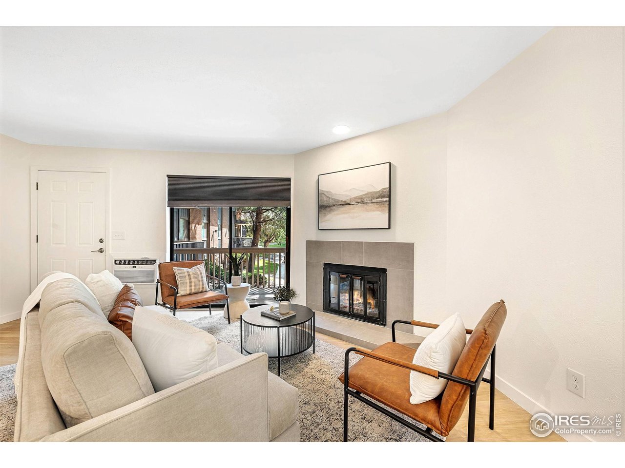 2800 Kalmia Avenue, Unit A-220 Boulder, CO 80301 - Photo 6 of 38 The living room features a wood burning fireplace for cozy evenings