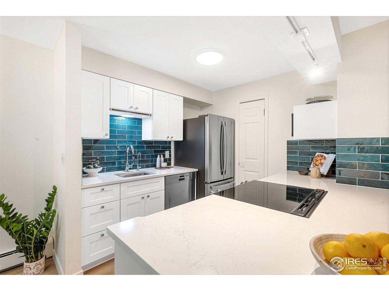 2800 Kalmia Avenue, Unit A-220 Boulder, CO 80301 - Photo 10 of 38 The recently updated stylish, bright and efficient kitchen features an induction cooktop, Bosch dishwasher and French door refrigerator