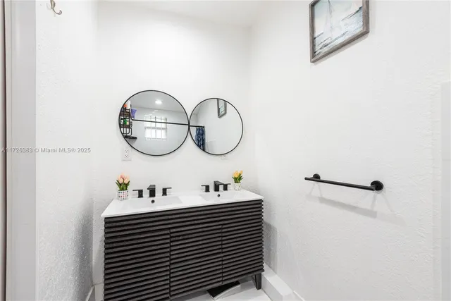 a bathroom with a toilet a sink and a shower