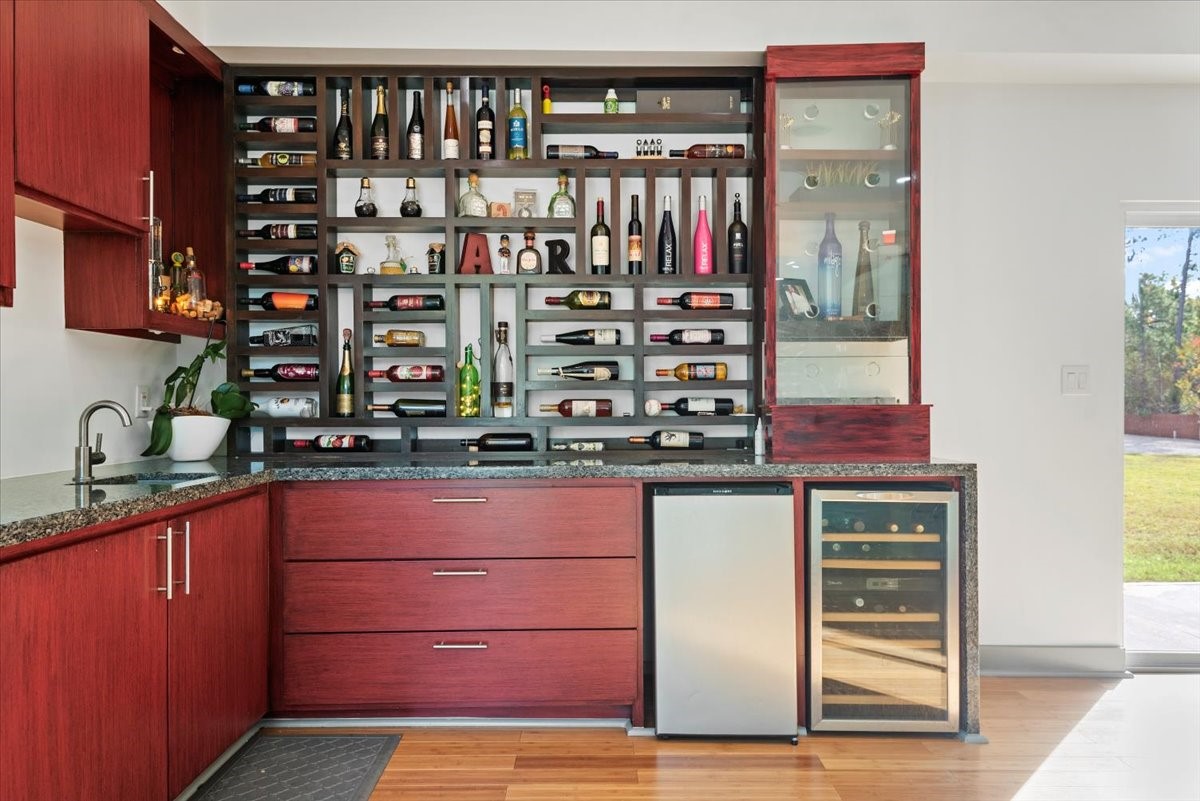 30400 Highland Boulevard Magnolia, TX 77354 - Photo 13 of 50 a kitchen with a refrigerator and cabinets