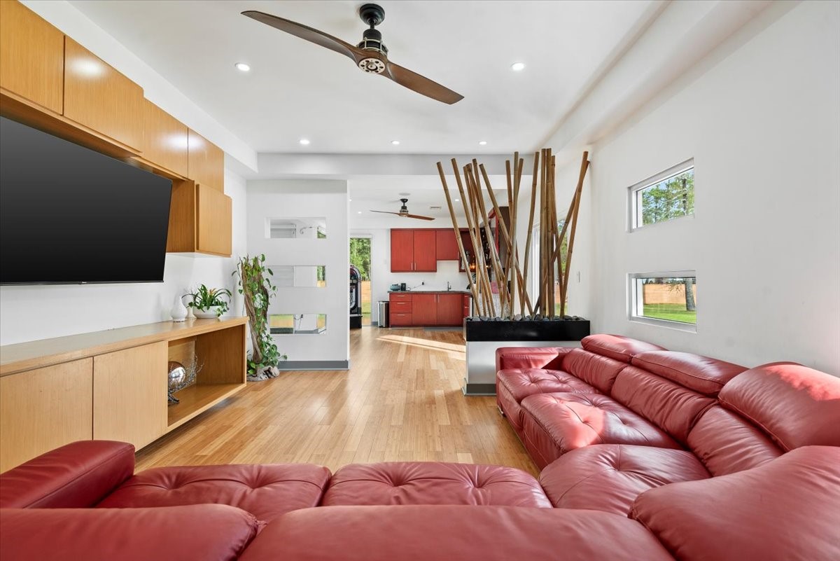 30400 Highland Boulevard Magnolia, TX 77354 - Photo 14 of 50 a living room with furniture and a flat screen tv