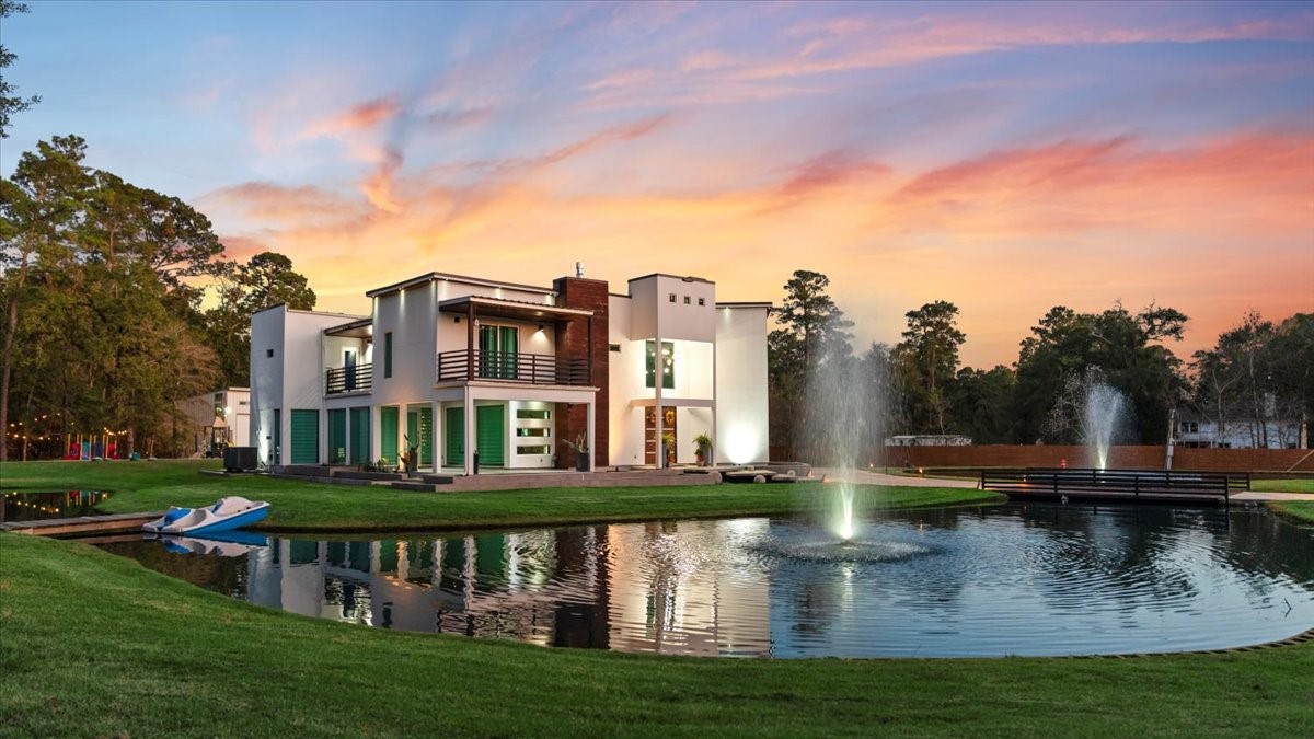 30400 Highland Boulevard Magnolia, TX 77354 - Photo 2 of 50 a view of building with river in front of it