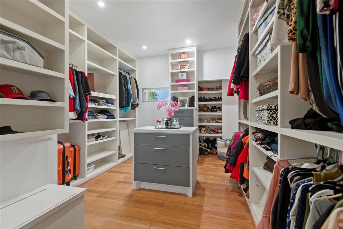 30400 Highland Boulevard Magnolia, TX 77354 - Photo 25 of 50 a view of walk in closet with clothes and shoes