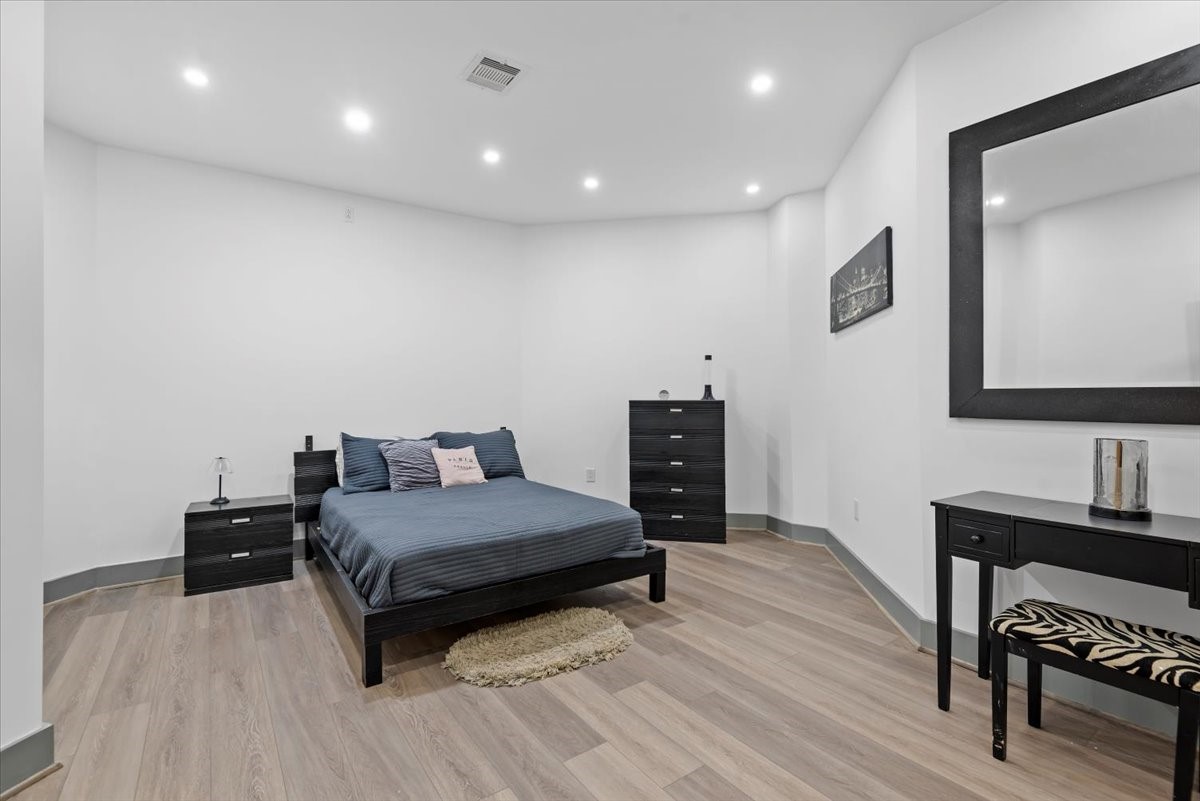 30400 Highland Boulevard Magnolia, TX 77354 - Photo 28 of 50 a spacious bedroom with a bed and a table in it