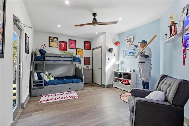 a balcony with furniture and a potted plant