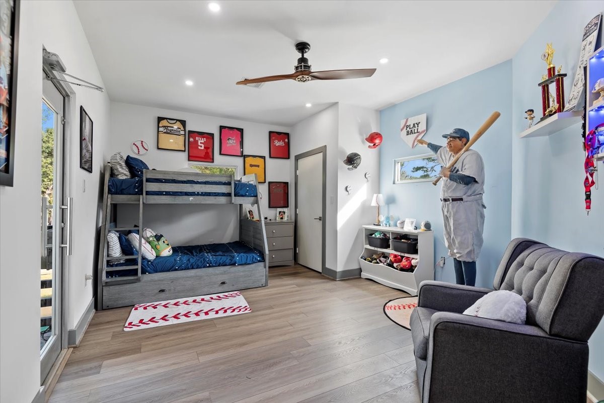 30400 Highland Boulevard Magnolia, TX 77354 - Photo 31 of 50 a living room with furniture and a flat screen tv