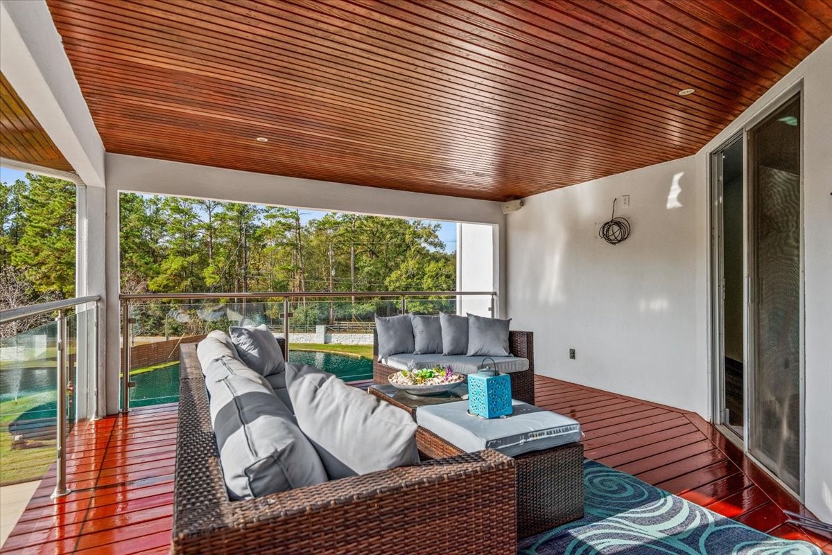 30400 Highland Boulevard Magnolia, TX 77354 - Photo 33 of 50 a living room with furniture and a large window