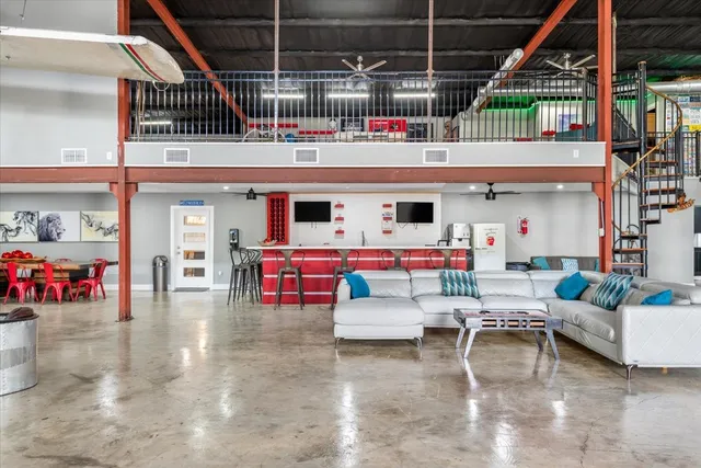 a view of a dining area with furniture and a flat screen tv
