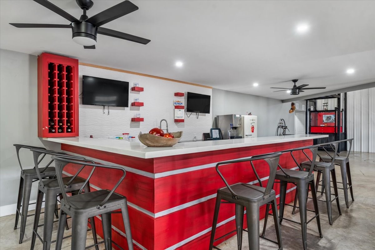 30400 Highland Boulevard Magnolia, TX 77354 - Photo 37 of 50 a view of a dining area with furniture and a flat screen tv