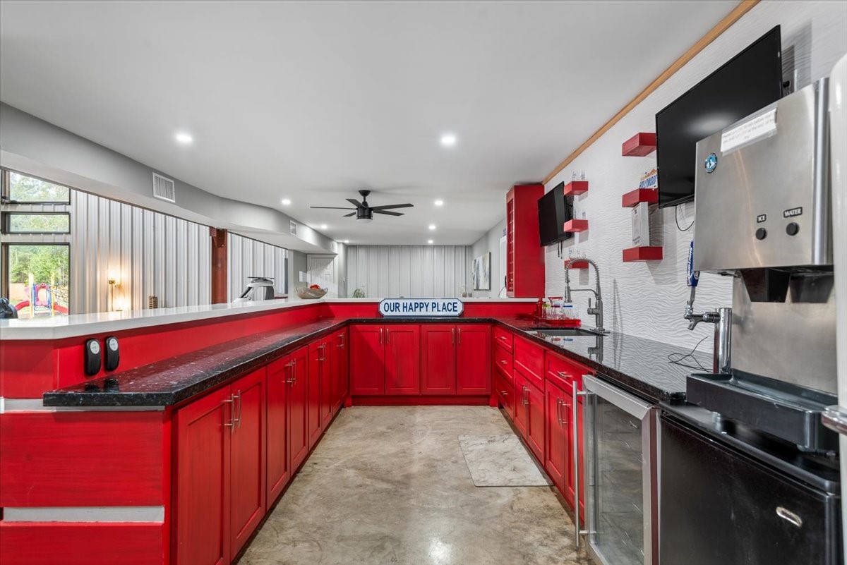 30400 Highland Boulevard Magnolia, TX 77354 - Photo 38 of 50 a kitchen with stainless steel appliances granite countertop a kitchen island a large stove a sink dishwasher and cabinets with wooden floor